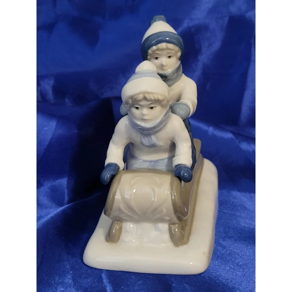 Porcelain Figurine Paul Sebastian Porcelana  Cuernavaca Children on Sled Vintage